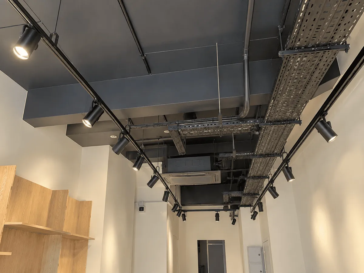 Track lighting and cable trays going in on a commercial fit-out